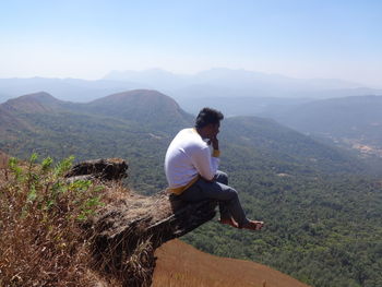 Young man looking at mountains