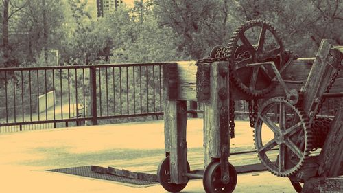 Bicycle wheel against trees