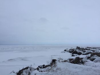 Scenic view of sea against sky during winter