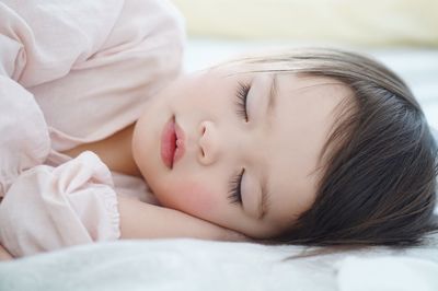 Girl sleeping in bed