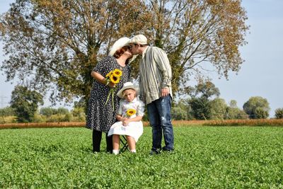 Full length of father with daughter against trees