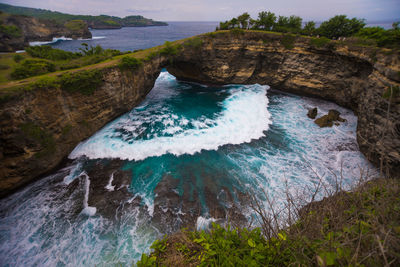 High angle view of rock formations in sea