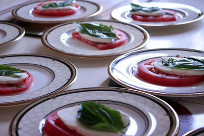 High angle view of caprese salad served in plates