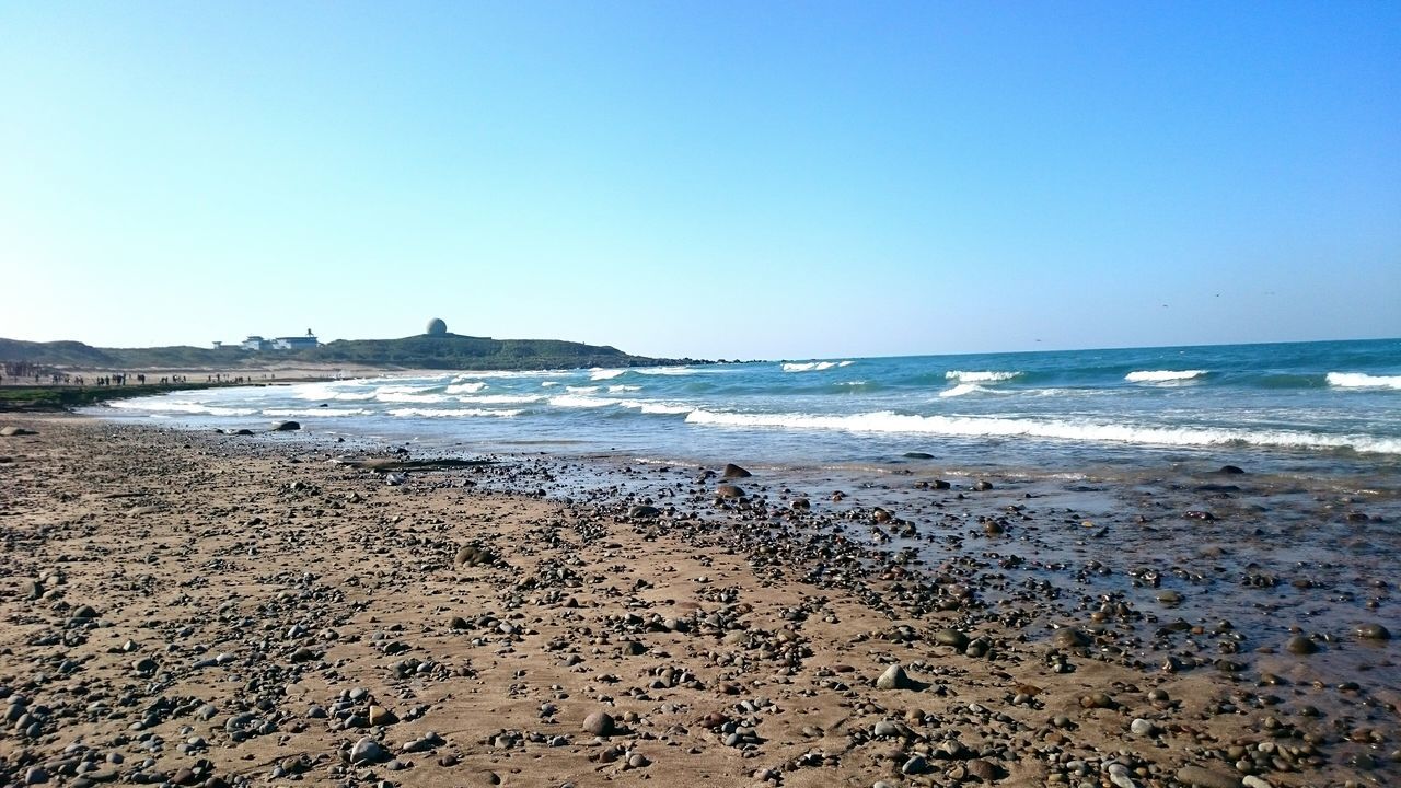 beach, sea, water, clear sky, horizon over water, shore, sand, copy space, scenics, tranquil scene, beauty in nature, tranquility, wave, blue, nature, surf, coastline, idyllic, outdoors, remote