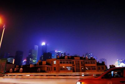 Illuminated building against sky at night