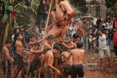 Group of people walking in water