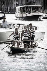 People in front of boat