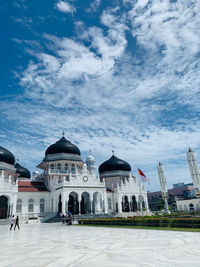 View of buildings in city against sky