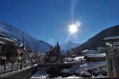 Scenic view of snow covered mountains against sky