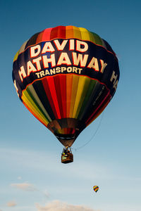 Low angle view of hot air balloons against sky