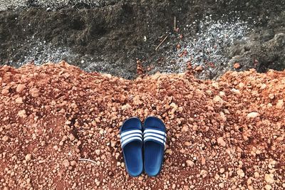 High angle view of shoes on beach