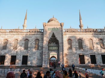 Group of people in front of historic mosque