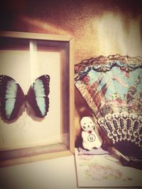 Close-up of butterfly on table