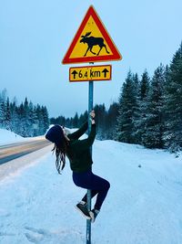 Low angle view of man on snow covered land