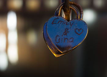 Close-up of love padlocks hanging on metal