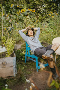 Portrait of male volunteer sitting in urban farm