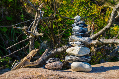 Stack of stones on rock in forest