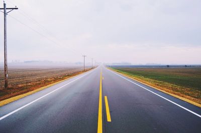 Empty road against sky