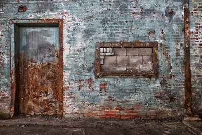 Closed door of old abandoned building