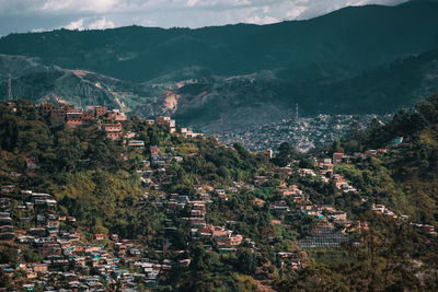 High angle view of townscape and mountains