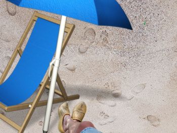 Low section of person on sand