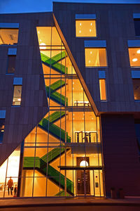 Low angle view of illuminated building at night