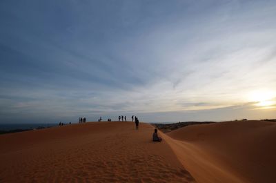 Scenic view of beach against sky during sunset