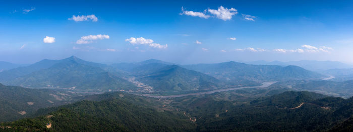 Panoramic view of mountains against blue sky