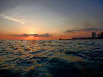 Scenic view of sea against sky during sunrise 