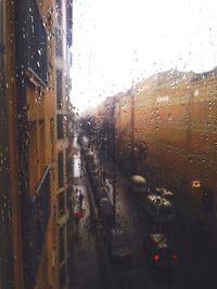 Road seen through wet car window