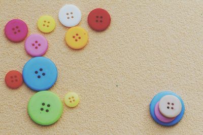 Close-up of colorful buttons on table