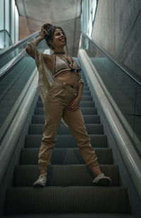 Young woman on staircase