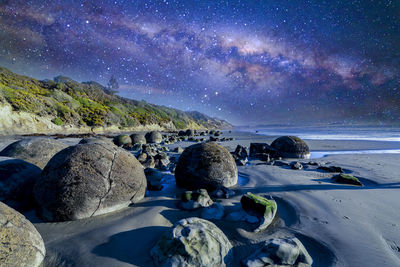 Scenic view of sea against sky at night