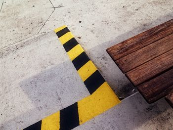 High angle view of arrow symbol on road