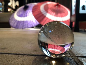 Close-up of crystal ball on glass table