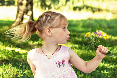 Portrait of a girl with pink flower