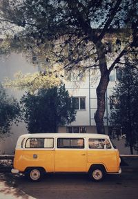 Yellow car parked on street