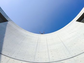 Low angle view of built structure against clear blue sky