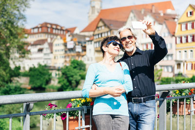 Woman wearing sunglasses standing outdoors