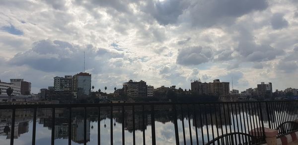 Panoramic view of river and buildings against sky