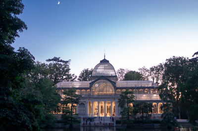 Illuminated government building against sky during sunset