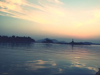 Scenic view of sea against sky at sunset