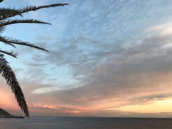 Scenic view of sea against sky at sunset