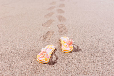 Close-up of cake on sand