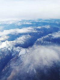 Scenic view of snow covered landscape against sky