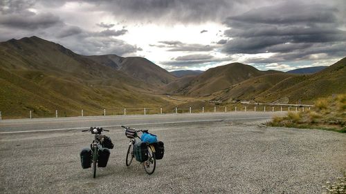 Scenic view of mountains against cloudy sky