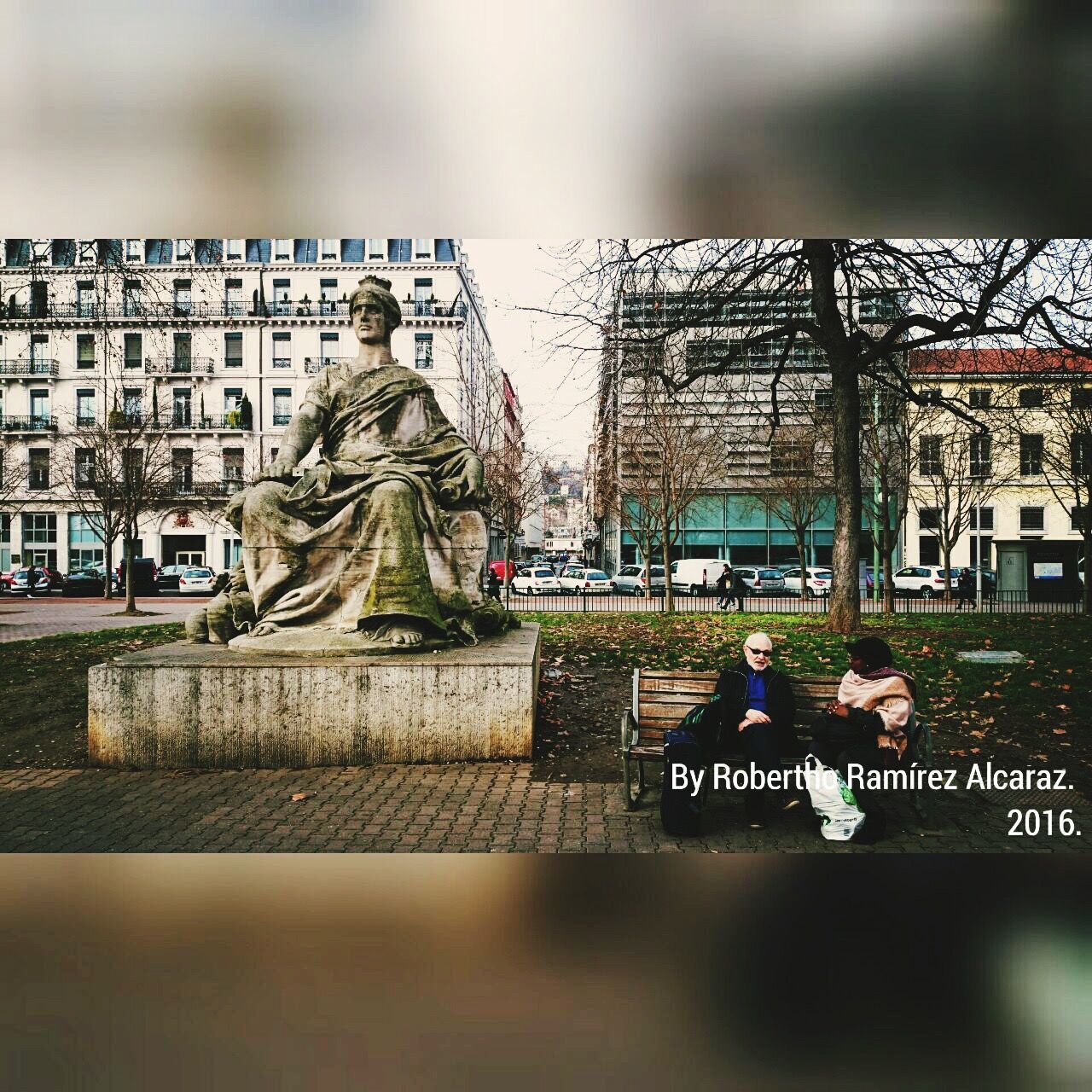 WOMAN STANDING IN CITY