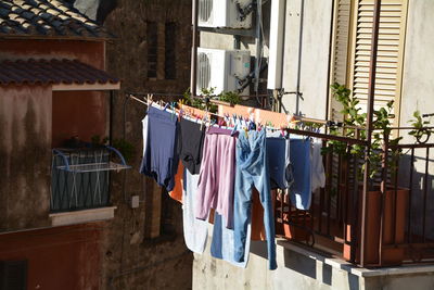 Clothes drying against houses in town