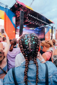 Rear view of people against sky