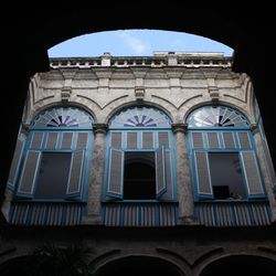 Low angle view of historical building against blue sky